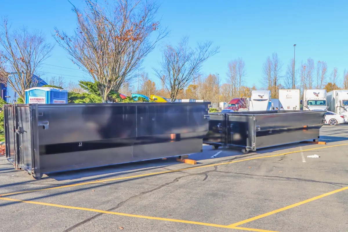 Professional dumpster rental service with roll-off container on residential driveway in Everett